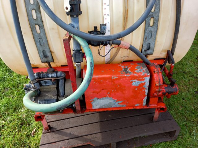 Front linkage mounted sprayer tank