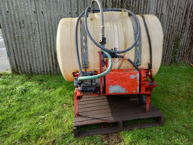 Front linkage mounted sprayer tank